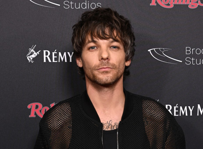 louis-tomlinson-greeted-as-hero-after-setting-up-tv-at-glastonbury-festival-to-screen-england’s-euro-2024-soccer-match